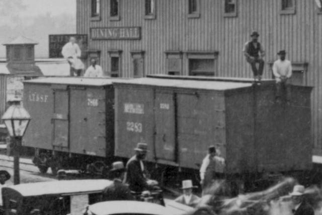 Boxcars beside depot.