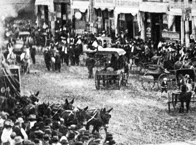 1896 wagons and people in street